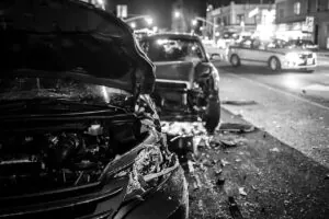 serious multi-car accident on a city street at night