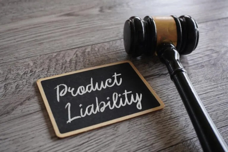 product liability is written in chalk on a small slate with a judge's gavel positioned next to it
