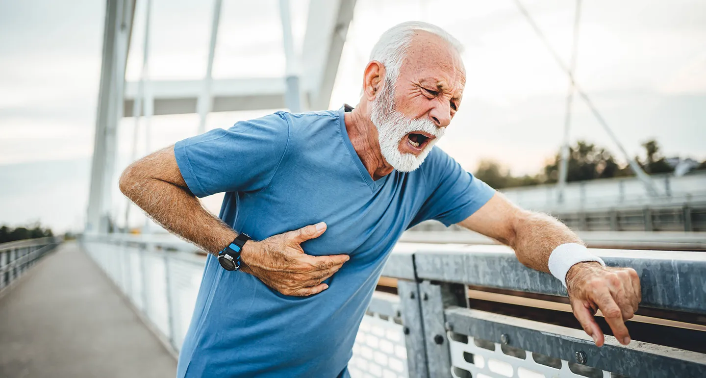 Man clutching chest in pain